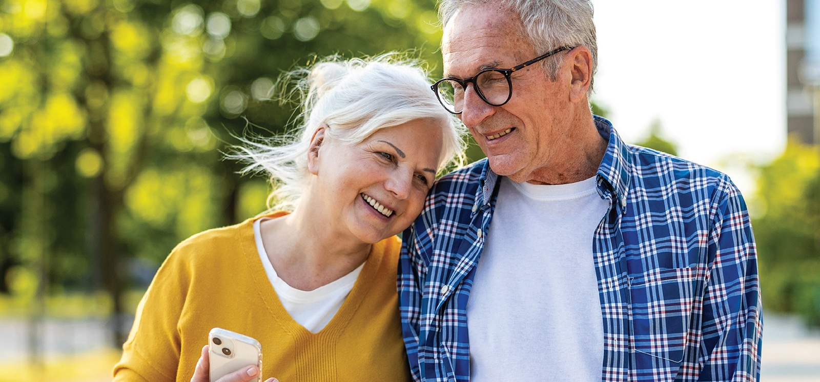 IMAGE: Older couple smiling and walking together